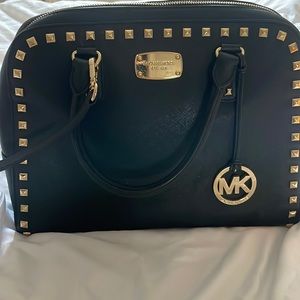 Classy black Michael Kors bag with gorgeous gold stud details!